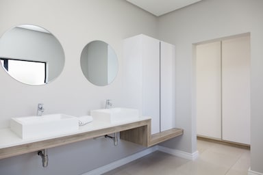 white bathroom cupboard round mirrors langebaan