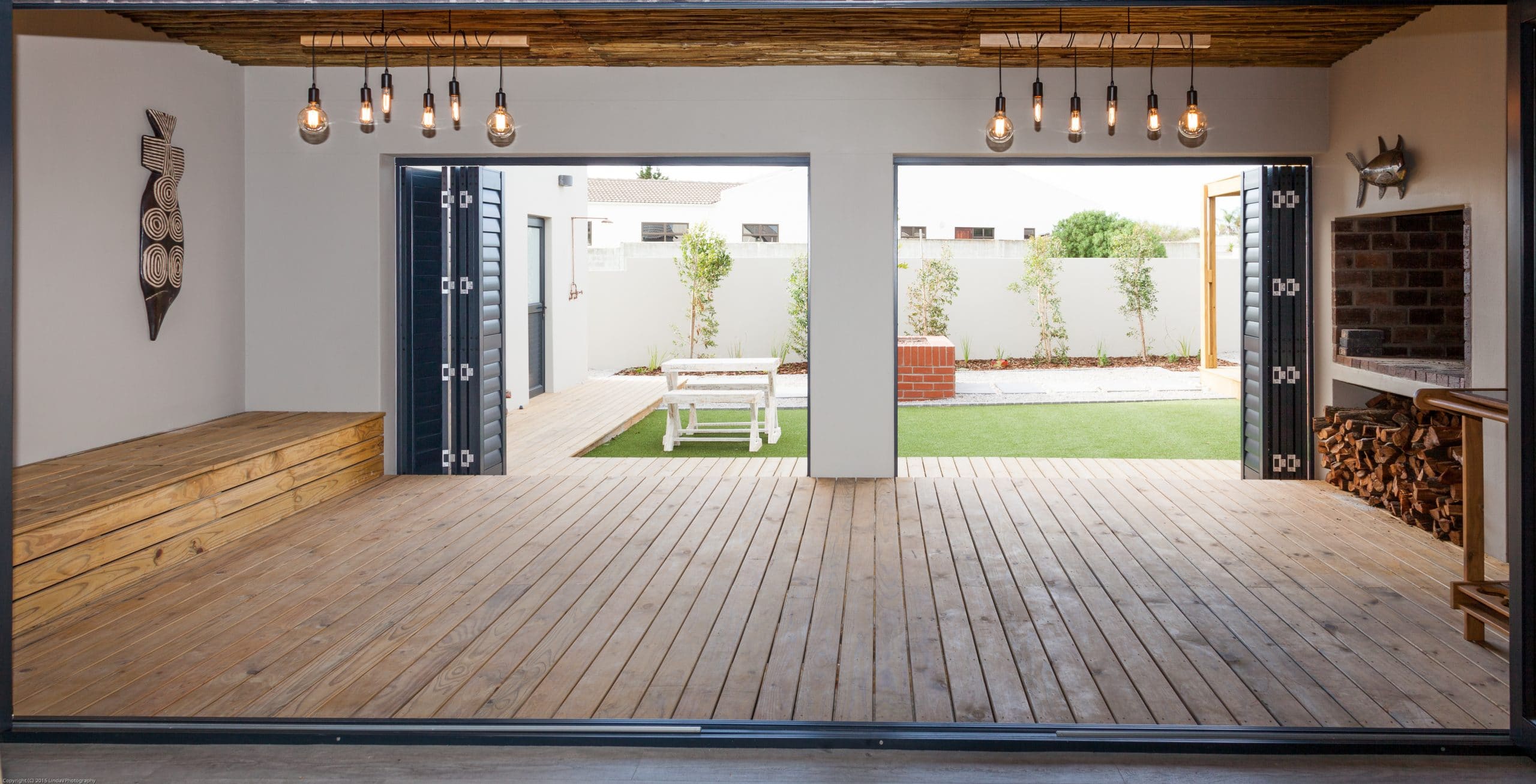 wooden timber decking enclosed patio braai area towards garden