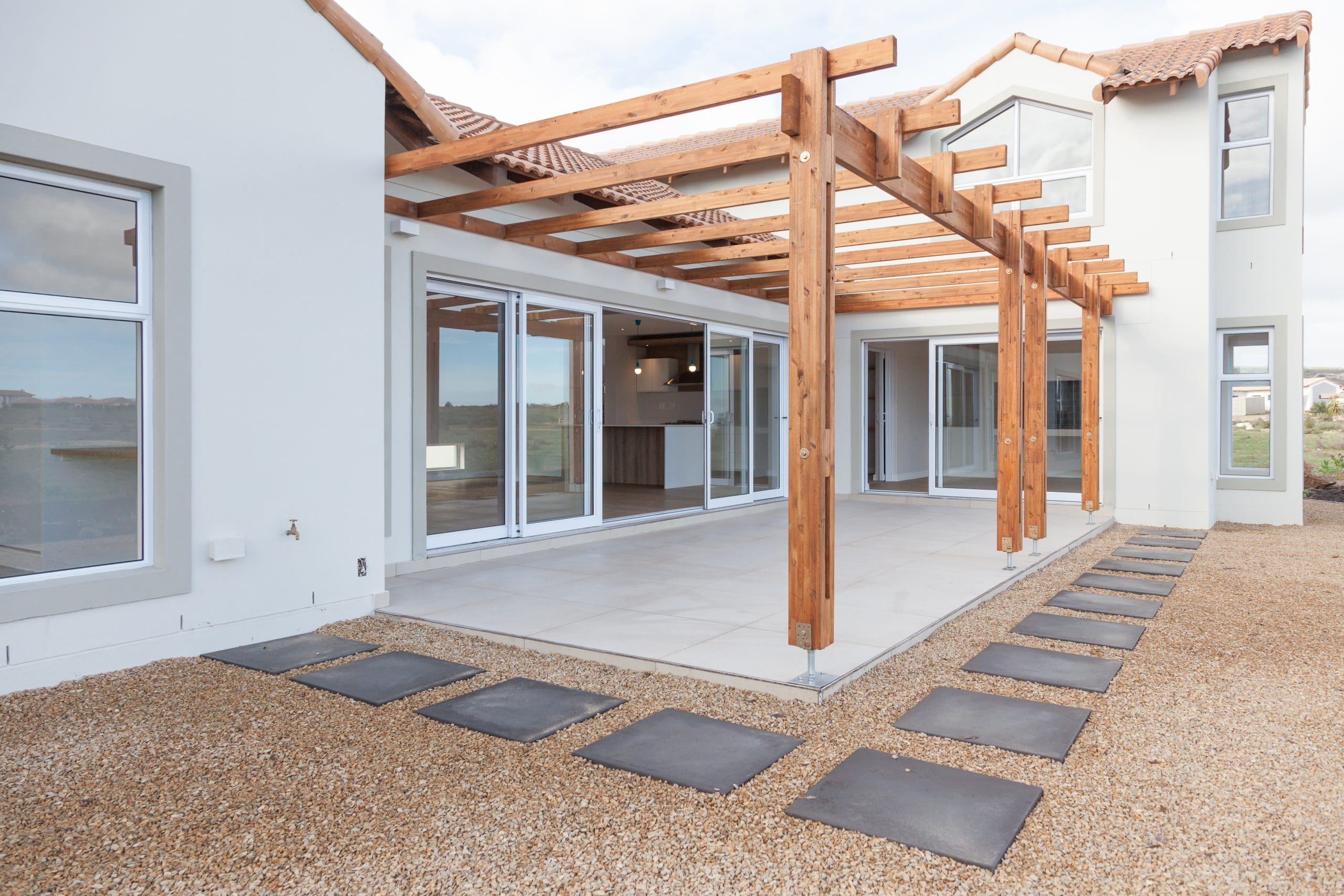 tiled open patio with wooden timber pergola langebaan country estate