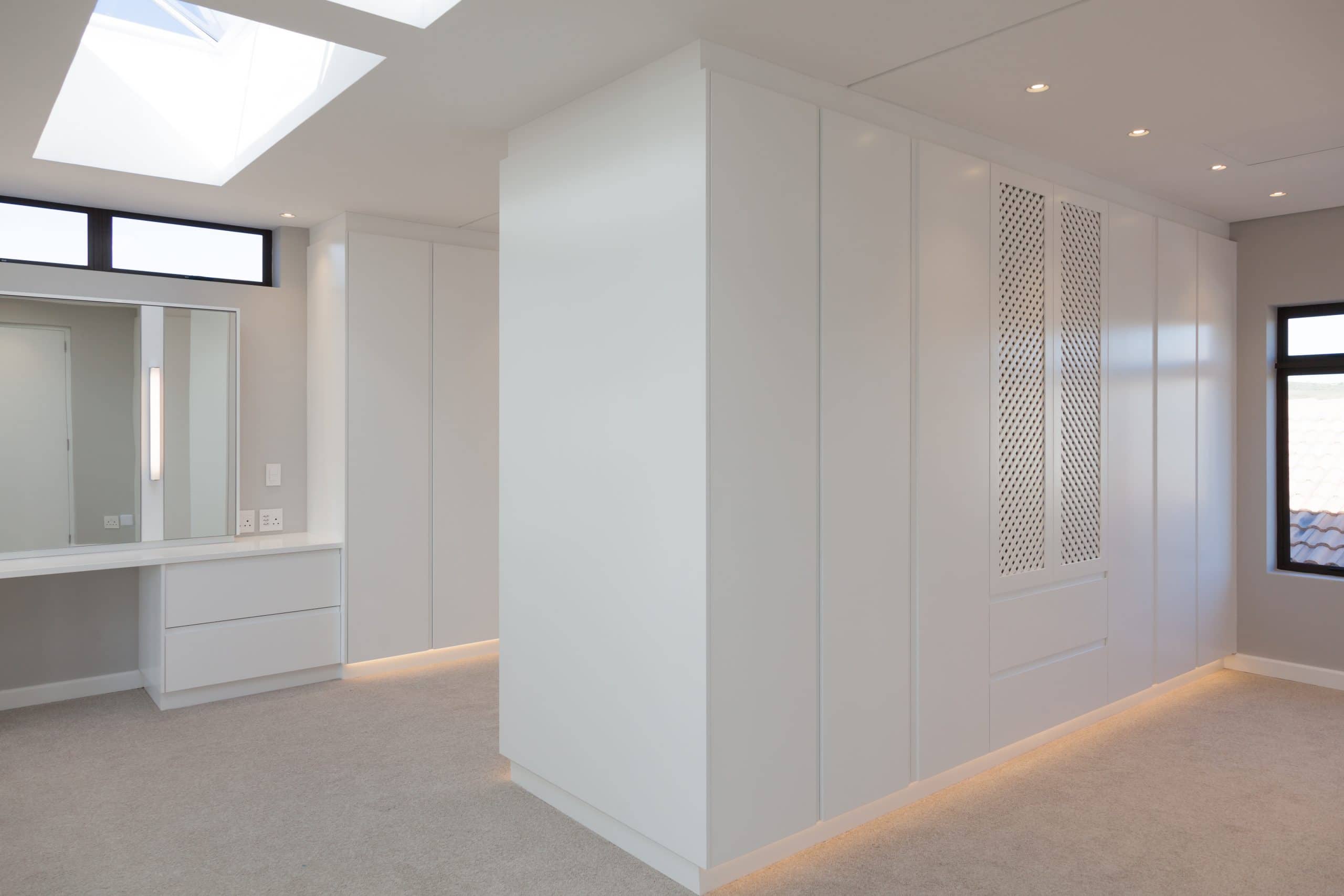 white walk in cupboards with dresser carpets led lights